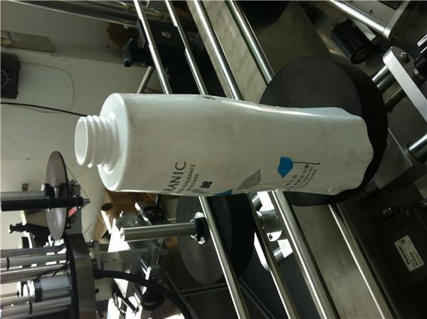 Zorientowany system etykietowania dookoła okrągłej butelki / pojemnika / słoika